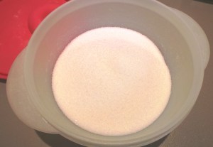 Put some sugar into your container.