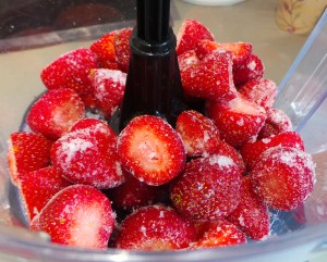 Place your frozen fruit in the food processor bowl.
