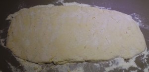 Press your dough out lightly into a rectangle.