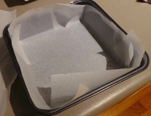Line a cake tin with parchment paper