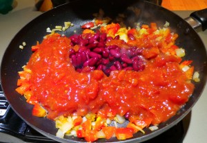 Add your canned goods to the pan.