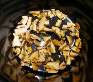 Break up the dried mushrooms and place a single layer on the bottom of your pot.
