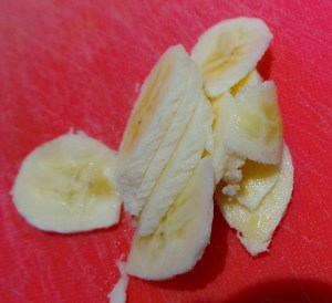 Slice a banana thinly.