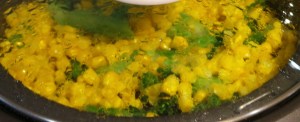 Steaming corn and broccolini stalks.